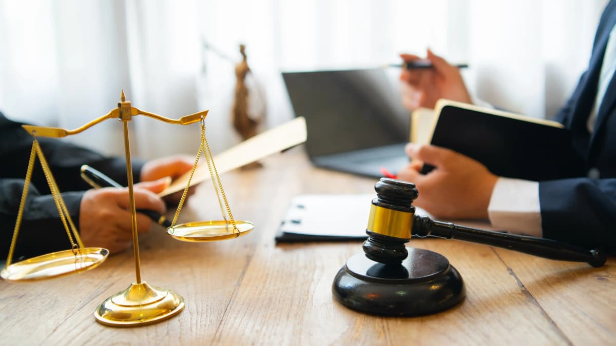 Lawyer in conference room with client.
