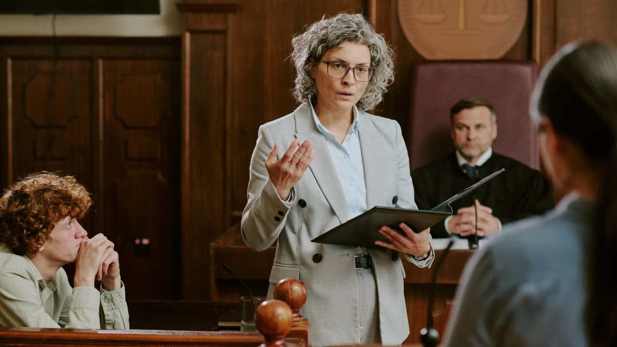 Female attorney making objection in courtroom.